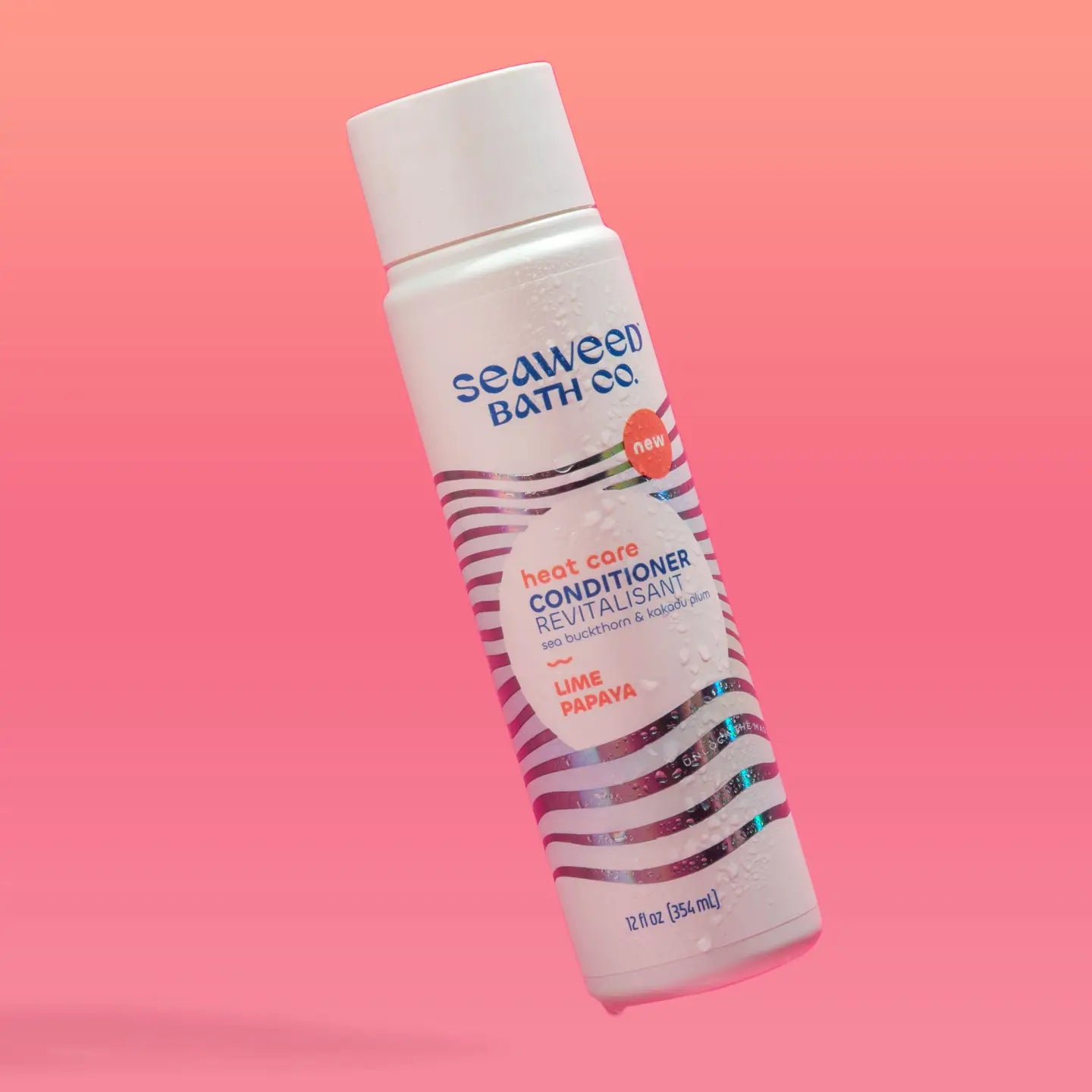Seaweed Bath Co Heat Care Conditioner Lime Papaya on a pink background