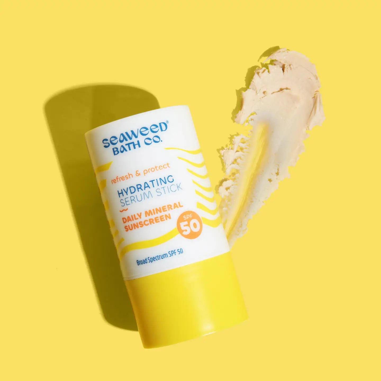 Seaweed Bath Co Hydrating Serun Stick SPF 50 on yellow background