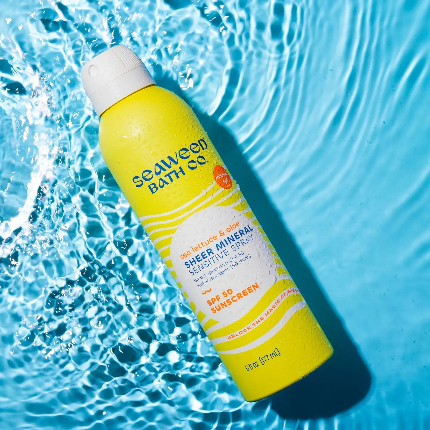 Seaweed Bath Co Sheer Mineral Sensitive Spray on a blue water background